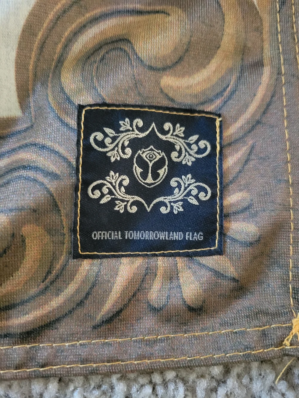 Official Tomorrowland Flag, a souvenir from the electronic dance music festival.